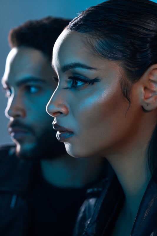 Couple in profile, leather jackets, cool blue light